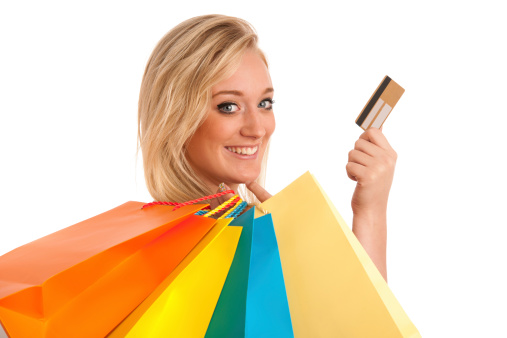 Attractive young woman with colorful shopping bags