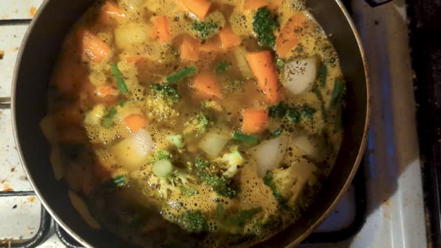 Vegetable stew boiling in a pan