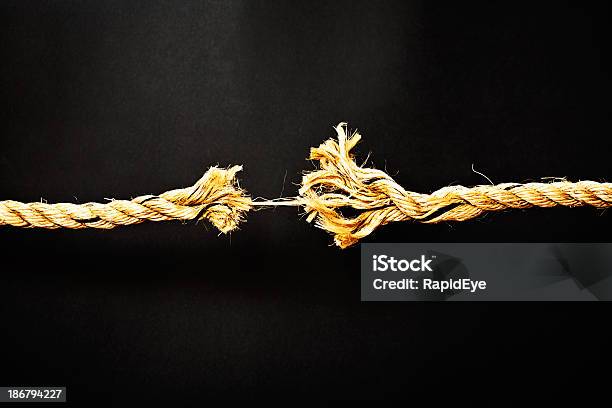 Extreme Stress Symbolized By Rope Frayed To Final Strand Stock Photo - Download Image Now