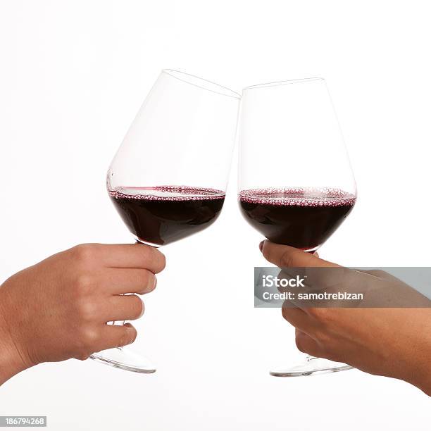 Two Glasses Of Red Wine In Hands Isolated Stock Photo - Download Image Now - Cut Out, Wineglass, Drinking Glass
