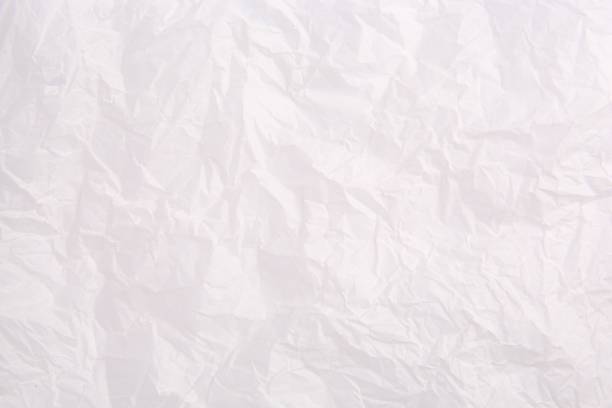 istock Texture of crumpled parchment paper as background, top view 1867957376