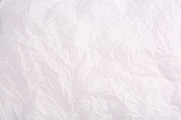 istock Texture of crumpled parchment paper as background, top view 1867957381