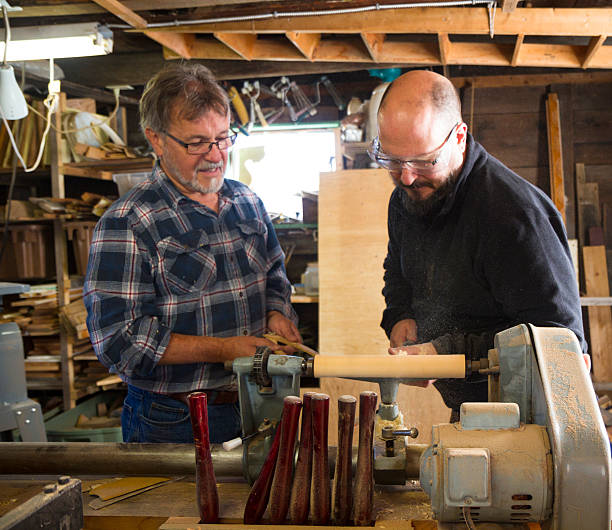 istock Teacher Showing Students How To Use A Lathe 186795934
