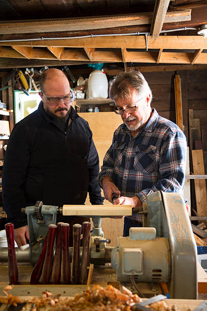 istock Teacher Showing Students How To Use A Lathe 186795938