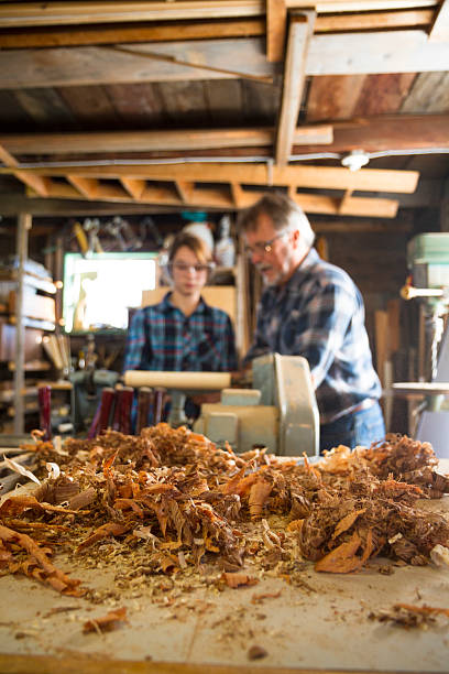 istock Teacher Showing Students How To Use A Lathe 186795949