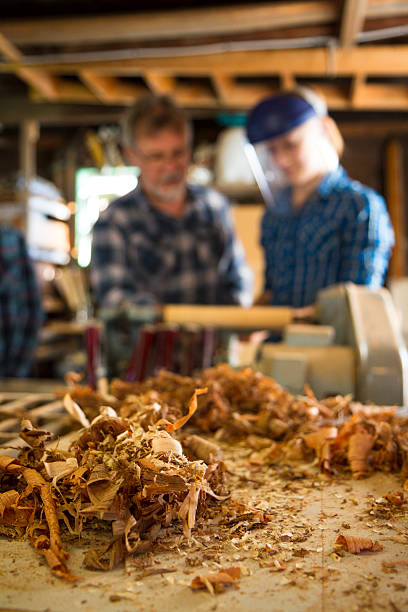 istock Teacher Showing Students How To Use A Lathe 186795958