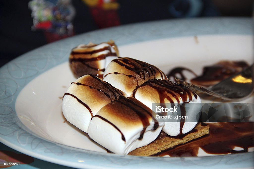 Fancy Restaurant Smores Fancy smores served on a plate with chocolate drizzled over the top. Oven Stock Photo