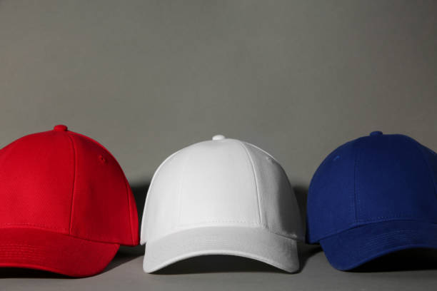 istock Stylish color baseball caps on grey background 1867961030