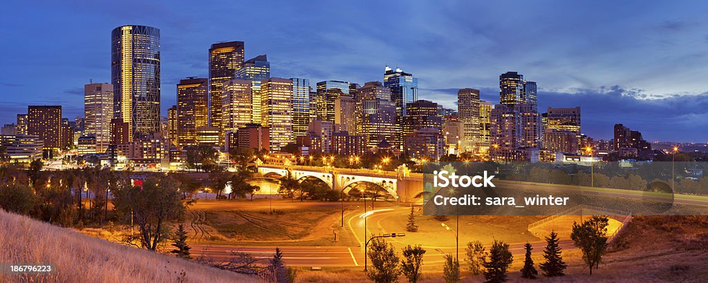 Skyline of Calgary, Alberta, Canada at night The skyline of downtown Calgary, Alberta, Canada, photographed at dusk. A seamlessly stitched panoramic image. Alberta Stock Photo