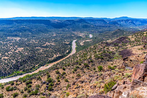 The view of the valley forged by the mighty Rio Grand River shot from the White Rock Overlook in White Rock, New Mexico just west of Santa Fe.