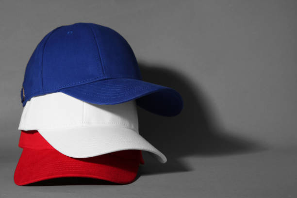 istock Stylish color baseball caps on grey background, space for text 1867963216