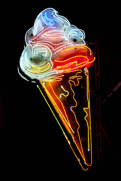 Neon Ice Cream Cone A neon light shaped into an ice cream cone. neon sign ice cream stock pictures, royalty-free photos & images