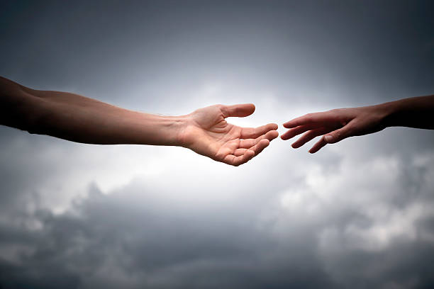 istock Male and female hands reaches out for help, copy space 186797761