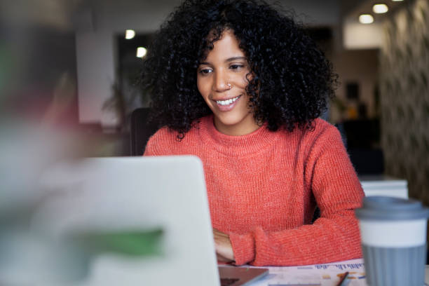 istock African American entrepreneur using laptop at cowork office 1867986263