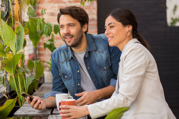 istock Coworkers taking a break from work while having a cup of coffee 1867986782