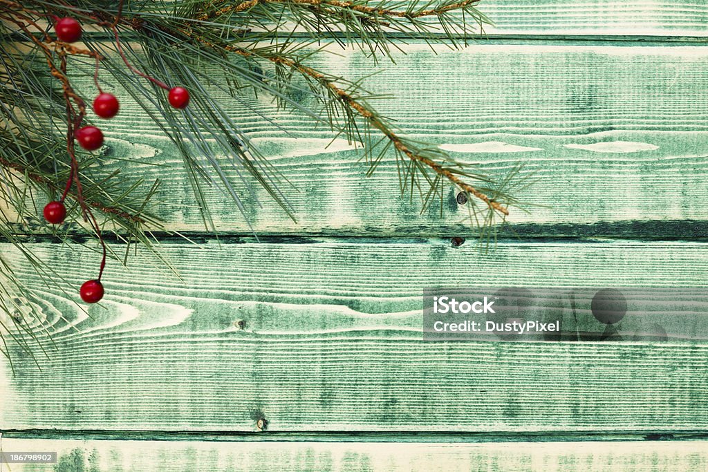 Green Rustic Christmas Christmas tree branch on rough sawn green wood sets the theme Blue Stock Photo