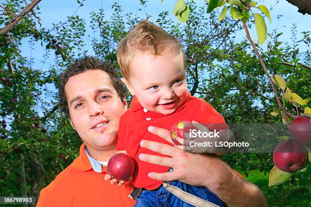Apple Father Holding Boy Stock Photo - Download Image Now - 2-3 Years, Adult, Apple - Fruit