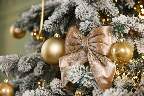 istock Beautiful decorated Christmas tree with baubles and lights on blurred background, closeup 1867993620