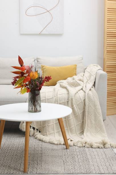 istock Living room with coffee table and comfortable sofa. Stylish interior design 1867995195