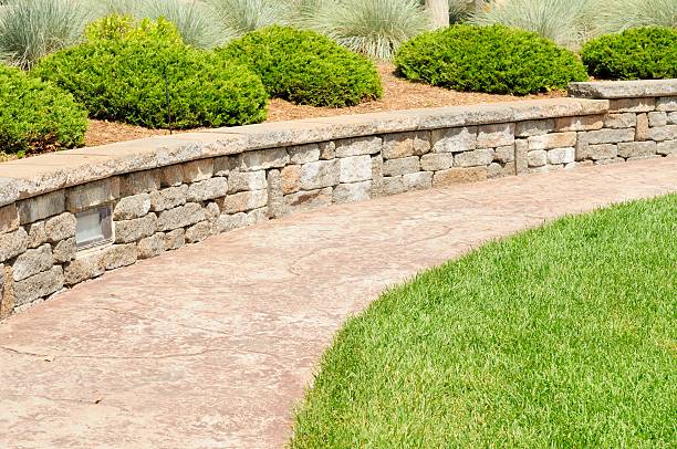Professional Landscaping A professional landscaping job with stone path and raised flowerbed. hardscape photos stock pictures, royalty-free photos & images
