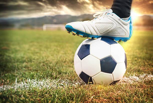 istock Foot on Soccer Ball 186801305
