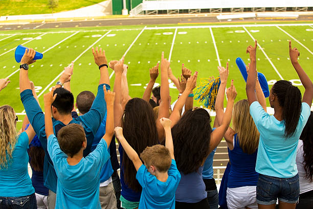 istock Sports: Fans cheer for their team during football game. 186801553