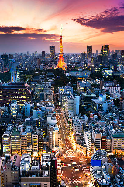 istock Illuminated gold tower in crowded a Tokyo city at dusk. 186801592