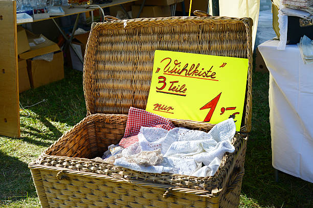 Flea market at Havelberg (Germany). In the foreground a box with doily and a piece of paper with inscription \
