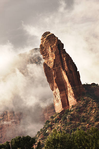 istock Rock Hoodoo Pinnacle Storm Mist Landscape 186803254