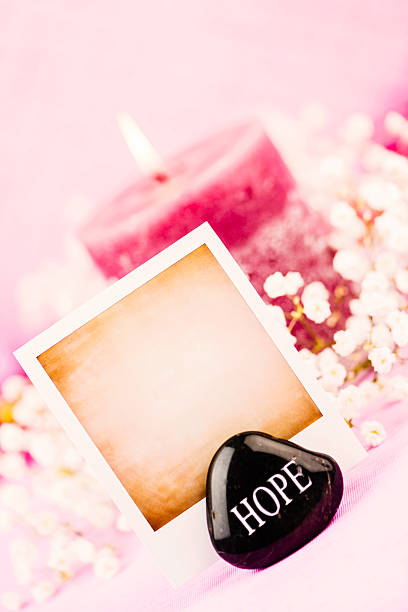 istock Pink Candle with Photo Frame and Message of Hope 186803771