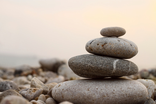 Pyramid of stones. Unstable balance of stone objects. Idyllic state of nature.