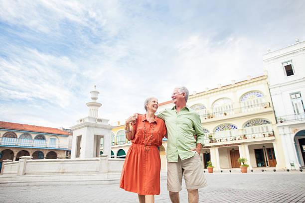 istock Senior couple walking together 186804235