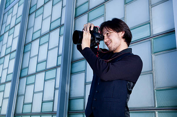 istock young handsome photographer taking photos 186804271
