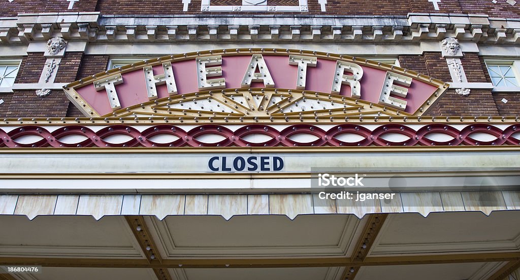 Old Theatre Closed This old theater is now closed.  Old brick building has great architectural details. Closed Sign Stock Photo