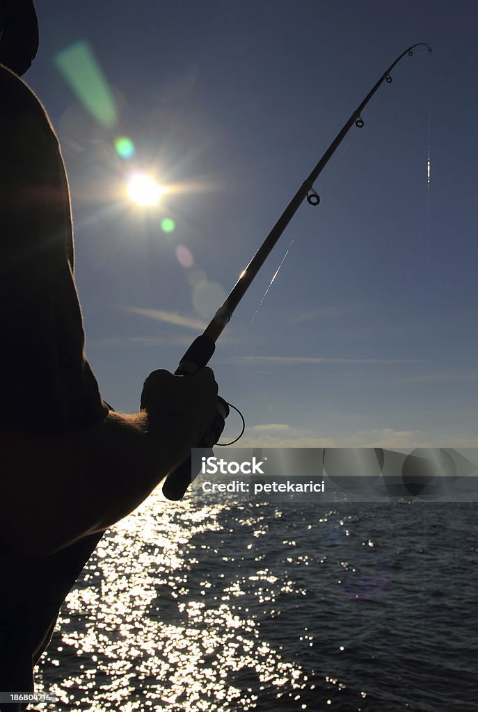 漁師のシルエット - 獲った魚のロイヤリティフリーストックフォト