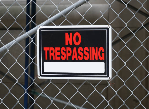 istock no trespassing warning sign on iron chain link fence 1868050606