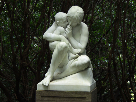 Statue of mother and child. Taken on a german cemetery.