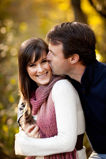 istock Happy Couple Sitting Together Outside During Autumn 186805202