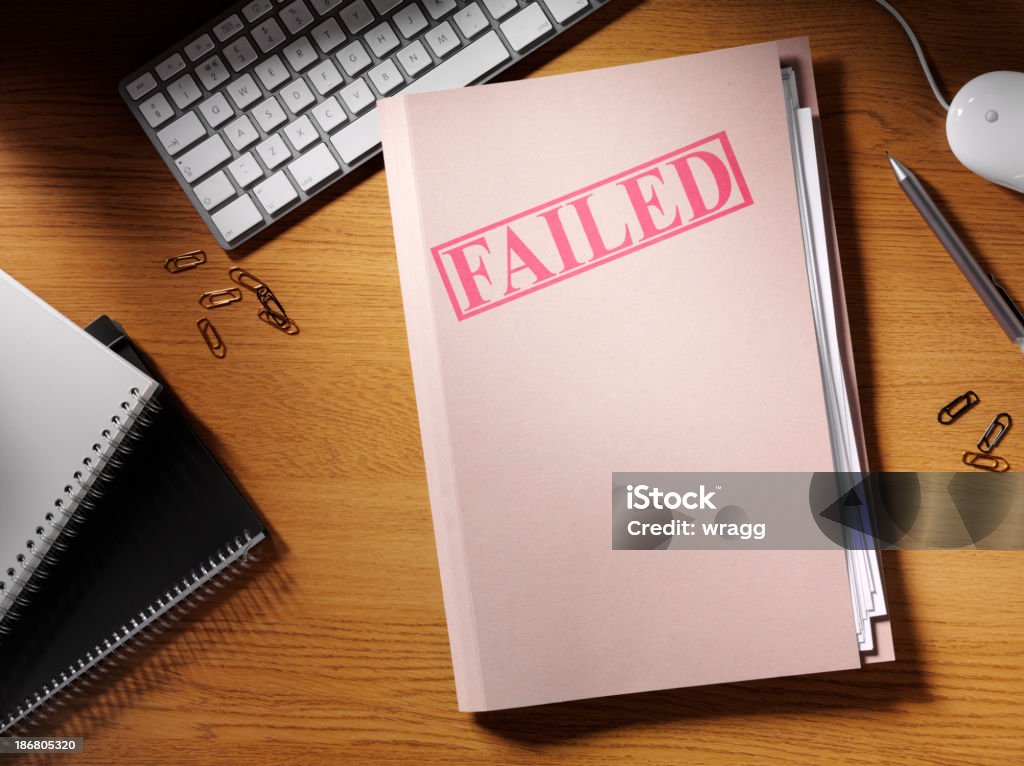 Failed Stamped on a Folder in the Office Failed stamped on a  folder on a desk in the office. Copy spaceClick on the links below to see more of my stationary and finance images. Failure Stock Photo