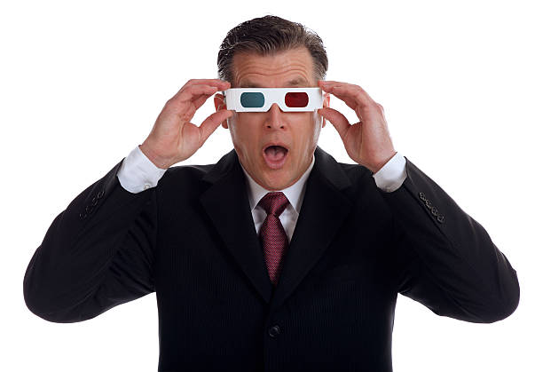 This is a photo taken in the studio on a white background of a surprised businessman with 3-D glasses on.There are similar images in the lightbox below: