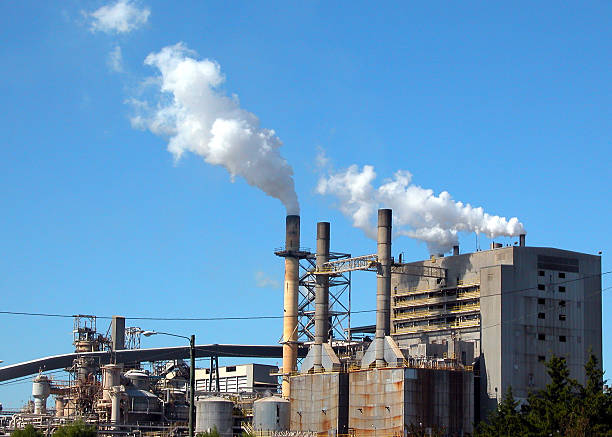 Industrial emission stacks stock photo