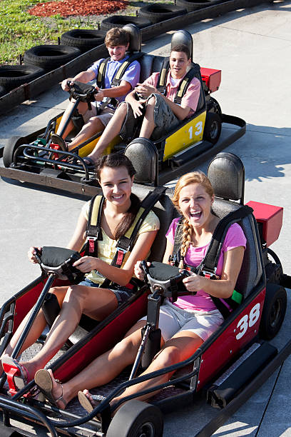 istock Teenagers riding go-carts 186805749