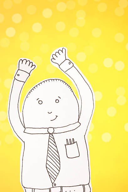 Paper white collar worker doll on a yellow defocused light background smiling and doing the mexican wave. The paperdoll is designed by me and a property release is included. This is an exclusive image and it can only be found in iStockphoto.
