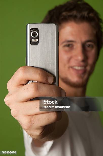 Young Man Taking A Picture With Her Camera Phone Stock Photo - Download Image Now - 20-29 Years, Adult, Adults Only