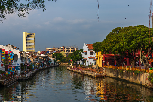 Malacca City, Malaysia - February 28th 2018: Buildings on the banks of the Malacca River.