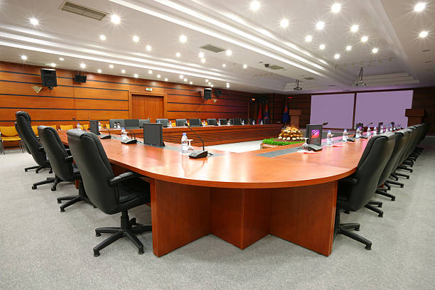 istock A board room with chairs, microphones and monitors 186806505