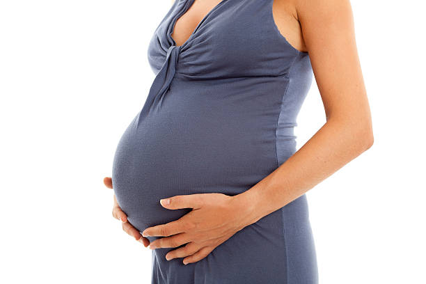 istock Woman touching pregnant belly 186806581