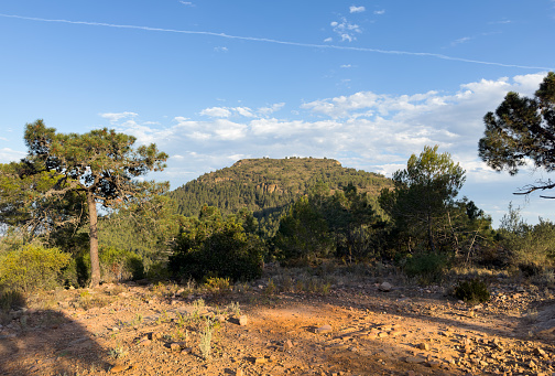 Mountains landscape Mola de Segart. Trekking in Spain mountains. Hiking through canyon. Horizon panorama view of misty hills scenery. Valley in mountain natural park of Sierra Calderona. Valencia