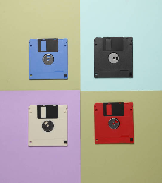 istock Floppy disks on colored background. Creative layout, retro 80s, top view, conceptual pop 1868069406