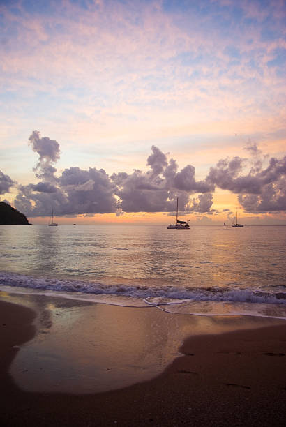 istock scenic caribbean beach at sunset with yachts 186807224